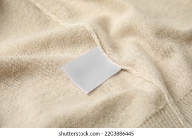 Warm Beige Cashmere Sweater With Clothing Label, Closeup