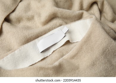 Warm Beige Cashmere Sweater With Clothing Label, Closeup