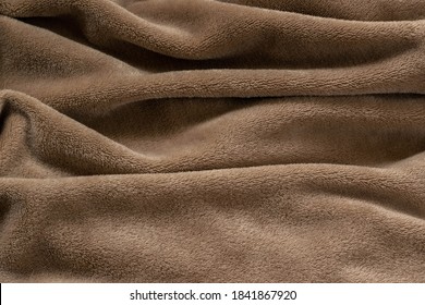 A Warm Blanket Plush Micro Fleece Fabric, Swirled Into A Pattern Background
