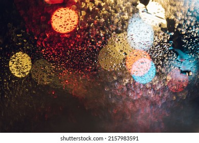 Warm Bokeh Lights In Shape Of Mound On Backdrop Of Evening Street Light In The City. Colorful Overlay Glitter Lights For Layout Design. Bokeh Glows Concept Of Celebration.