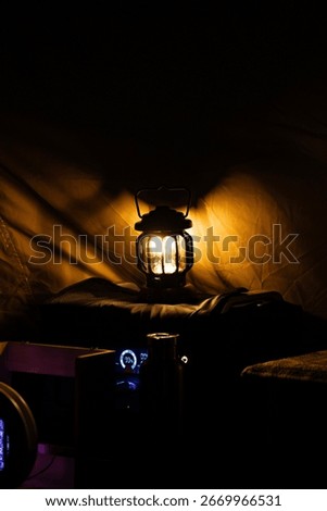 Warm Camping Lantern Light Inside Tent at Night