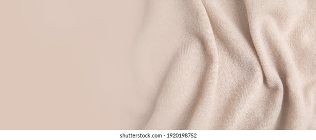 Warm cashmere fabric as background, top view with space for text. Banner design