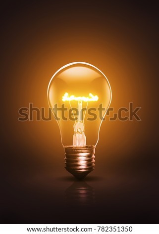 Warm colored and active bulb on a dark background.