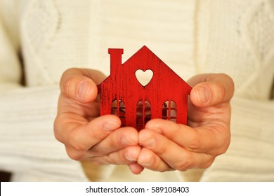 Warm And Cozy Miniature House In Female Hands. Care And Love.