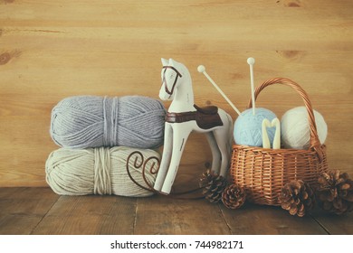 Warm And Cozy Yarn Balls Of Wool On Wooden Table