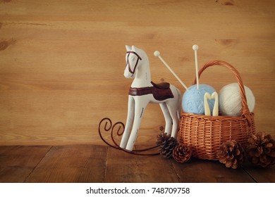 Warm And Cozy Yarn Balls Of Wool On Wooden Table