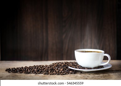 Warm Cup Of Coffee On Brown Background