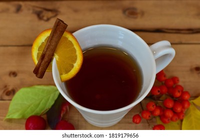 Warm Fall Beverage With Leaf Decor For Comfort On Cool Autumn Days Indoors