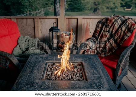 Warm Fall Evening on Backyard Patio with Fire Pit and Pumpkins