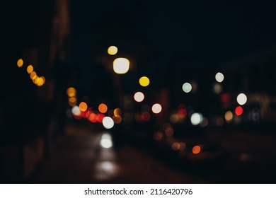 Warm Festive Bokeh Of String Lights Over An Outdoor Bar And Restaurant Patio At Twilight