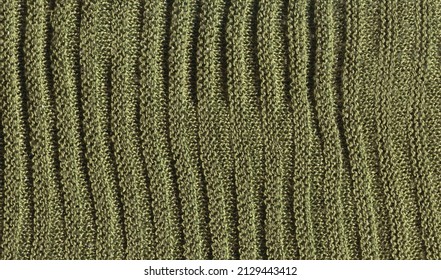 Warm green khaki knitted wool background. Beautiful knitted khaki wool textiles as a background. - Shutterstock ID 2129443412