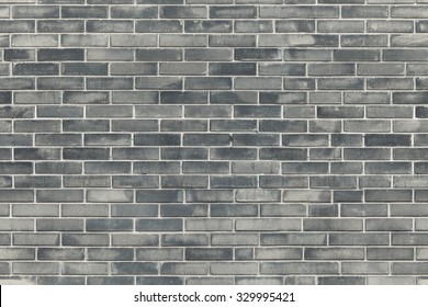 Warm grey brick wall texture background. Tiled. 