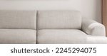 Warm grey sofa close up. Minimalistic furniture concept