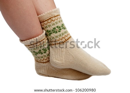 warm hand knitted wool socks on women foot