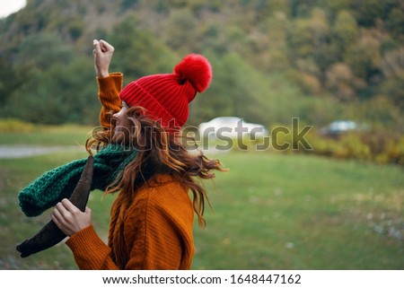 Warm hat beautiful woman orange sweater autumn nature