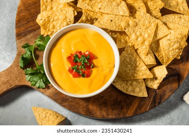 Warm Homemade Cheesy Queso Dip with Tortilla Chips - Powered by Shutterstock