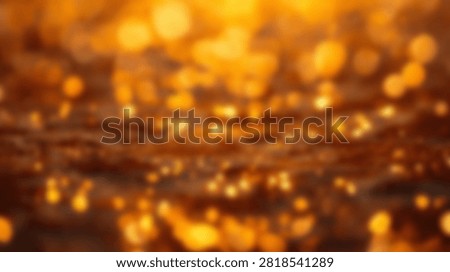 A warm and inviting abstract background featuring numerous golden bokeh lights creating a magical and festive atmosphere.