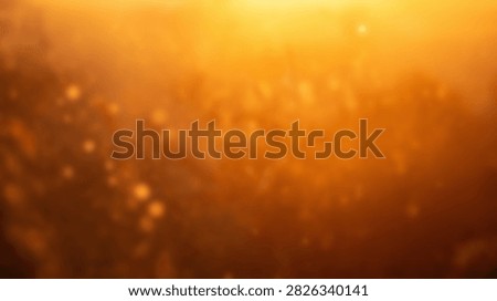 A warm and inviting abstract background featuring golden bokeh lights and a soft focus effect, perfect for festive or celebratory themes.