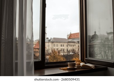 A warm, inviting composition featuring a cup of coffee, a croissant, and an open book on a windowsill, with a scenic city view through the window.