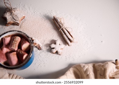 A warm and inviting winter setup featuring hot chocolate with marshmallows, star-shaped gingerbread cookies, and cinnamon sticks on a powdered sugar-coated surface. - Powered by Shutterstock