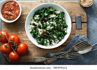 Warm Kale Salad With Brown Rice And Cranberry Overhead Shot