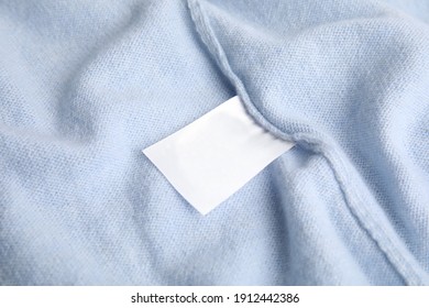 Warm Light Blue Cashmere Sweater With Clothing Label, Closeup