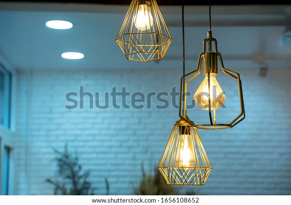 Warm light bulbs in coffee shops,Get and idea\
concept with copy space.