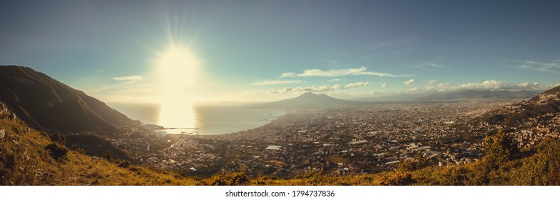 Warm light illuminating the gulf of Naples with vesuvio and the mount Faito ovr the city of Castellammare. - Shutterstock ID 1794737836