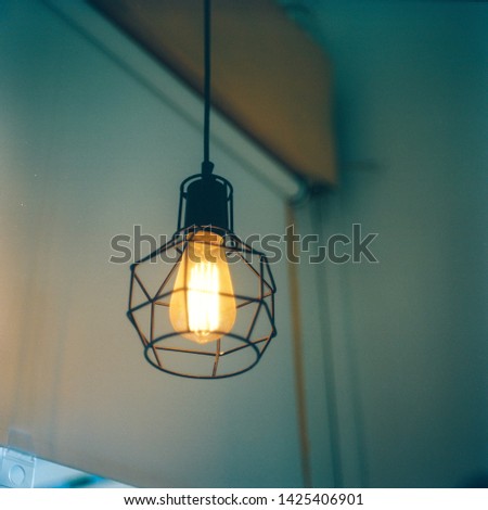warm light from lamp in cafe corner with medium format filmcamera