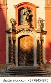 Warm light and shadows on the facade of the Basilica of St. George (Bazilika Svateho JirI) within the Prague Castle complex the oldest preserved Romanesque church. Prague, Czech Republic 