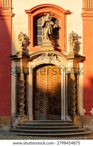 Warm light and shadows on the facade of the Basilica of St. George (Bazilika Svateho JirI) within the Prague Castle complex the oldest preserved Romanesque church. Prague, Czech Republic 