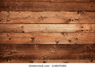 Warm Orange And Red Brown Reclaimed Wood Surface With Aged Boards Lined Up. Wooden Planks On A Wall Or Floor With Grain And Texture. Neutral Stained Vintage Wood Background.