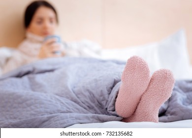 Warm Pink Socks Of An Ill Young Woman