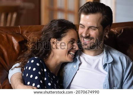 Similar – Image, Stock Photo Affectionate couple sharing a cozy moment on a sofa