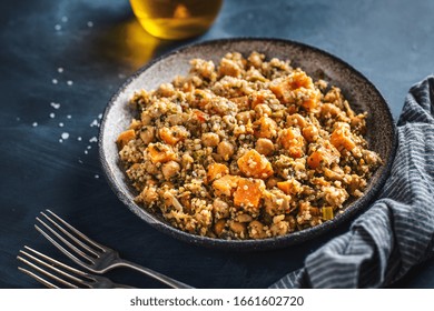 Warm Salad With Quinoa, Chickpeas And Sweet Potato Served On Plate On Dark Background. Vegan Or Vegetarian Food. 