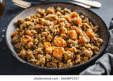 Warm Salad With Quinoa, Chickpeas And Sweet Potato Served On Plate On Dark Background. Vegan Or Vegetarian Food. 