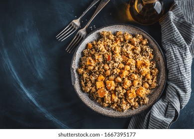 Warm Salad With Quinoa, Chickpeas And Sweet Potato Served On Plate On Dark Background. Vegan Or Vegetarian Food. 