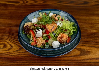 Warm Salad With Roasted Salmon In Sesame With Lettuce Leaves