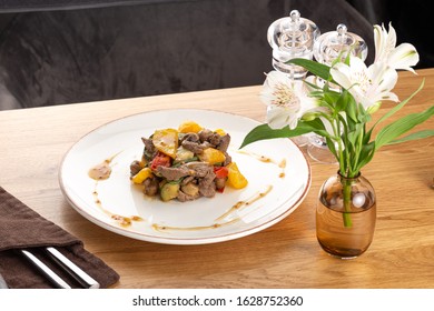 Warm Salad With Veal, Tomatoes, Peppers, Cucumber And Mushrooms On Wooden Background. Restaurant Food, Close Up. Meat Salad. Close Up View On Salad With Warm Baked Veal.