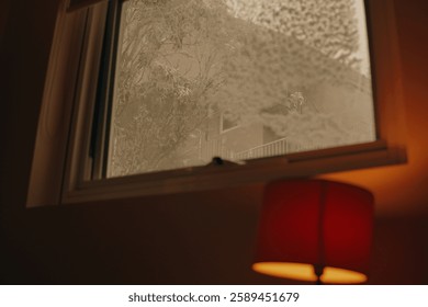 Warm snowy window with light