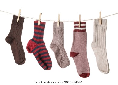 Warm Socks Hanging On Clothes Line Against White Background