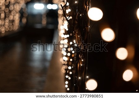 Warm String Lights Along Corridor with Bokeh Background – Festive Night Walkway, Copy Space