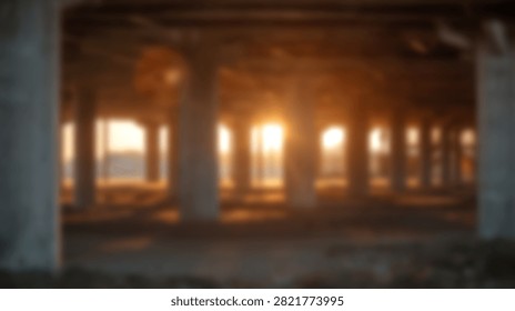 Warm sunlight glows through windows of a derelict warehouse structure with concrete columns and dark foreground