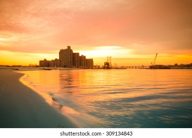 Warm Sunrise On The Coast. Overlooking The Atlantic Beach Bridge. East Rockaway Intel. New-York. US East Coast.