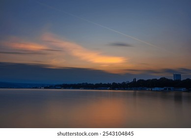 Warm sunset calm sea long exposure - Powered by Shutterstock