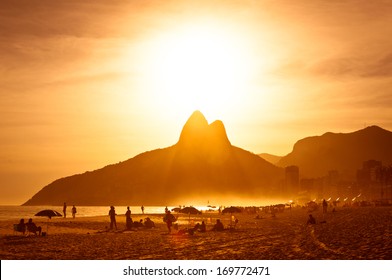 Warm Sunset On Ipanema Beach With People, Rio De Janeiro, Brazil