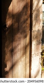 The Warm Sunset Sunlight Projected On The Old Wooden Door Of One Old Chinese Village House 