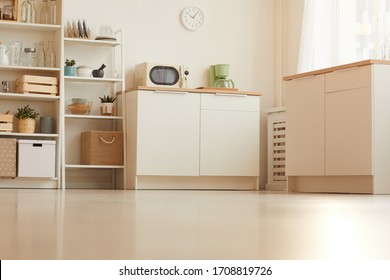 Warm toned low angle of contemporary kitchen interior with minimal design and wooden elements, copy space