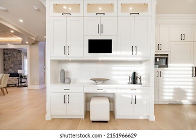 Warm White Kitchen With Expansive Countertops Island High End Appliances Spice Kitchen Black Leather Chair Dining Table Wine Fridge And Office Work Station