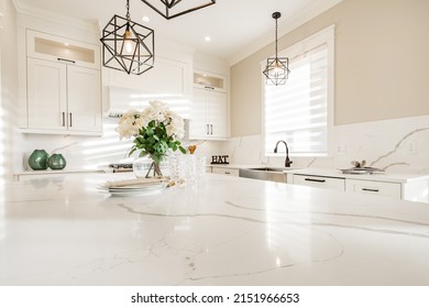 Warm White Kitchen With Expansive Countertops Island High End Appliances Spice Kitchen Black Leather Chair Dining Table Wine Fridge And Office Work Station